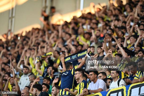 Fenerbahce's fans cheer prior to the UEFA Europa League group B football match between Fenerbahce SK and Dynamo Kyiv at the Fenerbahce Sukru...