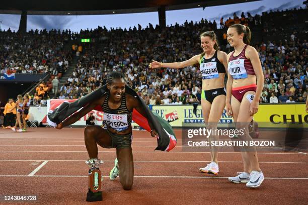 Kenya's Faith Kipyegon celebrates after victory with Ireland's Ciara Mageean and Britain's Laura Muir in the women's 1500m final during the Diamond...