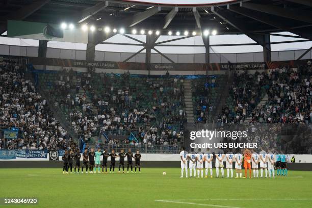 Zurich's and Arsenal's players line up during a minute of silence following the announcement of the death of Britain's Queen Elizabeth II ahead of...