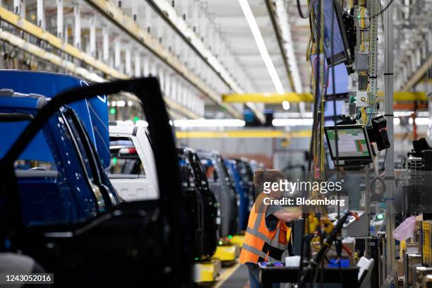 Worker on the Ford F-150 Lightning production line at the Ford Motor Co. Rouge Electric Vehicle Center in Dearborn, Michigan, US, on Thursday, Sept....