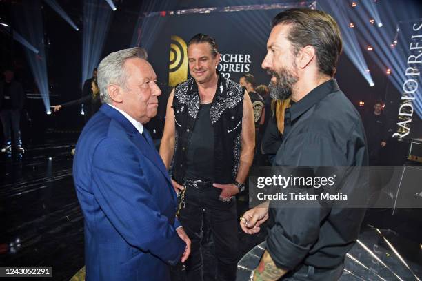 Alec Voelkel and Sascha Vollmer of the band The BossHoss and Roland Kaiser during the Deutscher Radiopreis 2022 at Schuppen 52 on September 8, 2022...