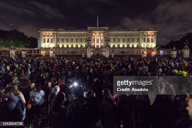 Members of the public gather outside Buckingham Palace following the announcement of the death of Queen Elizabeth II in London, United Kingdom on...
