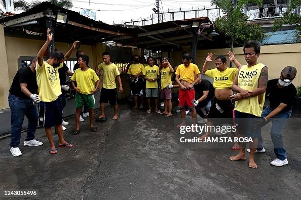 Police officers check prison inmates during an inspection for... News ...