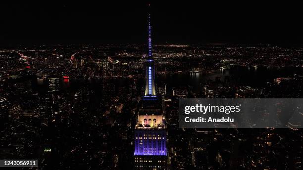 The Empire State Building in New York City lit up in purple and sparkled in silver n tribute to Queen Elizabeth II who died on Thursday at the age of...