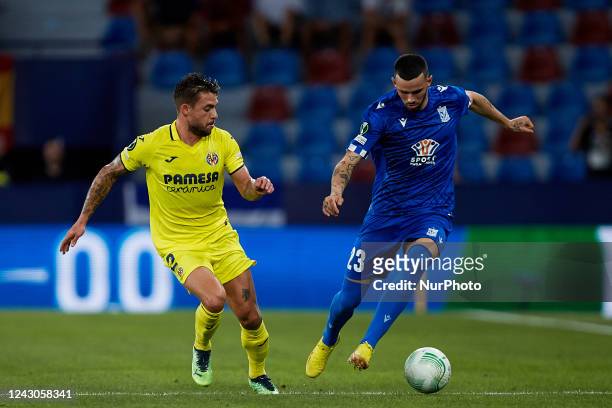 Kristoffer Velde of KKS Lech Poznan competes for the ball with Kiko Femenia of Villarreal CF during the UEFA Europa Conference League Group C match...