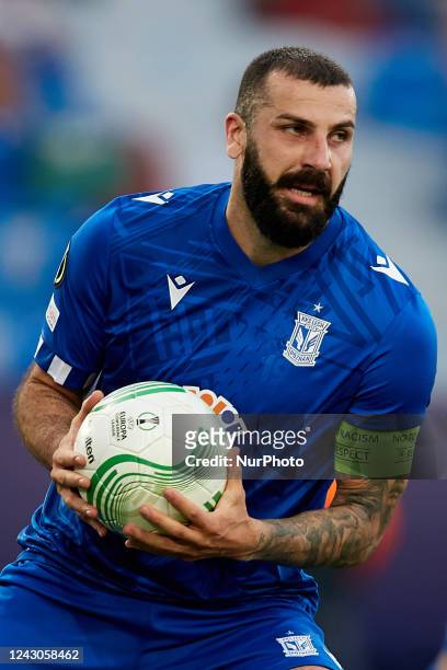 Mikael Ishak of KKS Lech Poznan holds the balls after scoring their side's second goal during the UEFA Europa Conference League Group C match between...