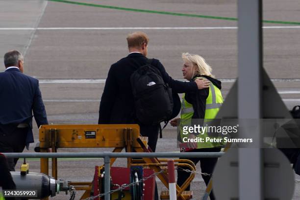 Prince Harry, Duke of Sussex boards a flight at Aberdeen Airport on September 9, 2022 in Aberdeen, United Kingdom. Elizabeth Alexandra Mary Windsor...