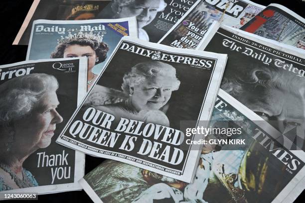 Photograph taken on September 9 shows the front pages of British news papers a day after Queen Elizabeth II died at the age of 96. Queen Elizabeth...