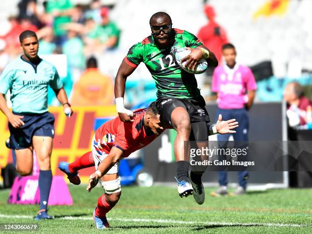 Willy Ambaka of Kenya and Edward Sunia of Tonga during day 1 of the Mens Rugby World Cup Sevens 2022 Pre-Round of 16, Match 5 between Kenya and Tonga...