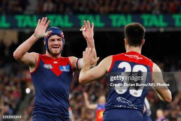 Angus Brayshaw of the Demons celebrates with Alex Neal-Bullen of the Demons during the 2022 AFL Second Semi Final match between the Melbourne Demons...