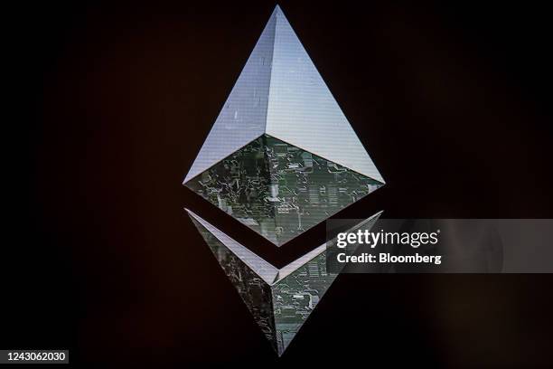 An Ethereum logo on an electronic screen inside a cryptocurrency exchange in Barcelona, Spain, on Thursday, Sept. 8, 2022. The upcoming 'merge' will...