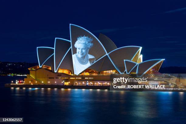 Australia iconic Opera House sails lit up with the picture of Britain's Queen Elizabeth II to commemorate her life on September 9 in Sydney.