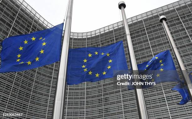 European flags fly at half-mast during a meeting of EU energy ministers to find solutions to rising energy prices at the EU headquarters in Brussels...