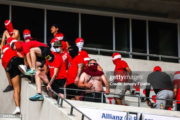 Fans Koln climb over the barriers of the curves before the UEFA Europa Conference League match between Nice and Koln at Allianz Riviera Stadium on...