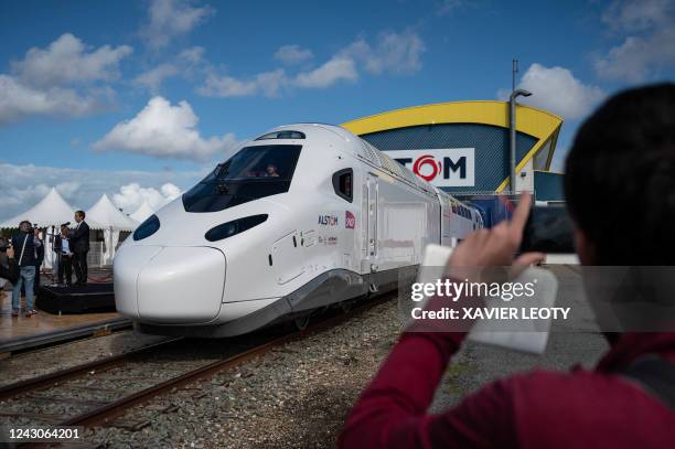 Invitees and journalists attend the presentation of the new SNCF's TGV "M" next generation high-speed train at the Alstom plant in La Rochelle,...