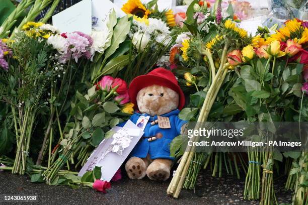 Floral tributes and a Paddington bear teddy are laid at the gates of Balmoral in Scotland, following the death of Queen Elizabeth II on Thursday....