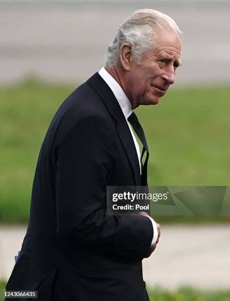 King Charles III at Aberdeen Airport as he travels to London with Camilla, Queen Consort following the death of Queen Elizabeth II on September 9,...