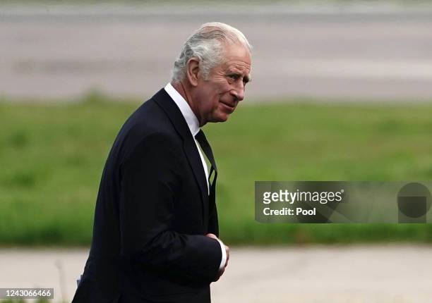 King Charles III at Aberdeen Airport as he travels to London with Camilla, Queen Consort following the death of Queen Elizabeth II on September 9,...