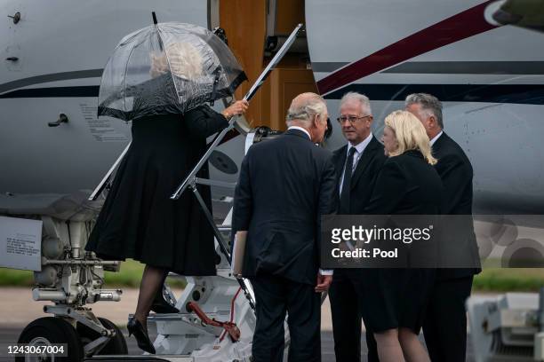 King Charles III and Camilla, Queen Consort board a plane at Aberdeen Airport to travel to London following the death of Queen Elizabeth II on...