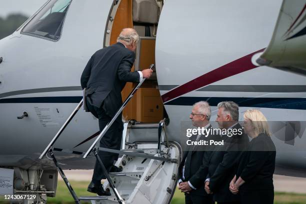 King Charles III boards a plane at Aberdeen Airport as he travels to London with Camilla, Queen Consort following the death of Queen Elizabeth II on...