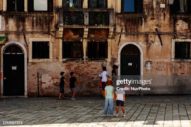 Children play football in a square in the centre of Venice, a city of art that is also popular with tourists during the Film Festival. In Venice,...