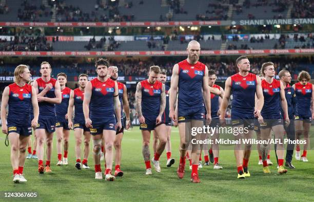 The Demons look dejected after a loss during the 2022 AFL Second Semi Final match between the Melbourne Demons and the Brisbane Lions at the...