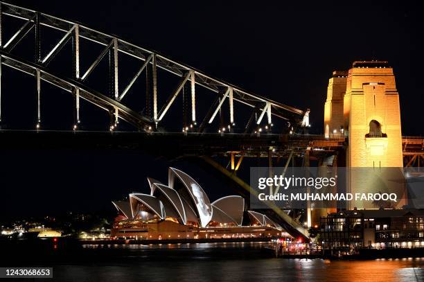 Australia iconic Opera House sails lit up with the picture of Britain's Queen Elizabeth II to commemorate her life, in Sidney on September 9, 2022.