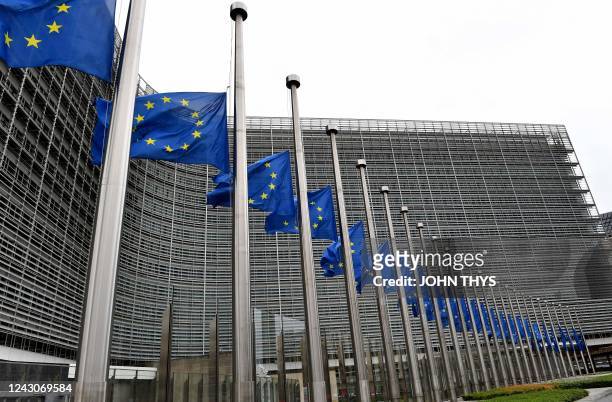 European flags fly at half-mast during a meeting of EU energy ministers to find solutions to rising energy prices at the EU headquarters in Brussels...