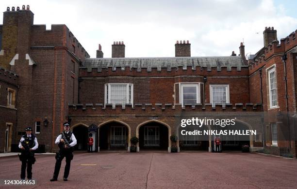 Police officers stand on duty in Friary Court at St James's Palace in London on September 9 a day after Queen Elizabeth II died at the age of 96. -...