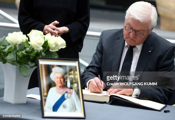 German President Frank-Walter Steinmeier signs a book of condolences for late Queen Elizabeth II at the British Embassy in Berlin, Germany on...