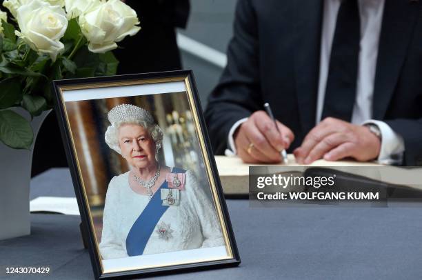 Portrait of Queen Elizabeth II is pictured at the British Embassy in Berlin, Germany on September 9 as the German President signs a book of...