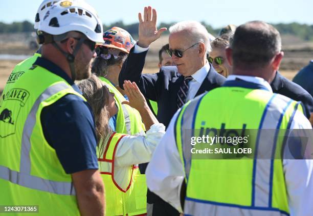 President Joe Biden greets workers at the groundbreaking of the new Intel semiconductor manufacturing facility near New Albany, Ohio, on September 9,...