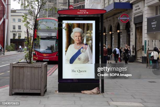 Victoria Station Bus Shelter Billboard bears a Queen Elizabeth II picture. Her Majesty the Queen Elizabeth II died peacefully on 8 September 2022 at...