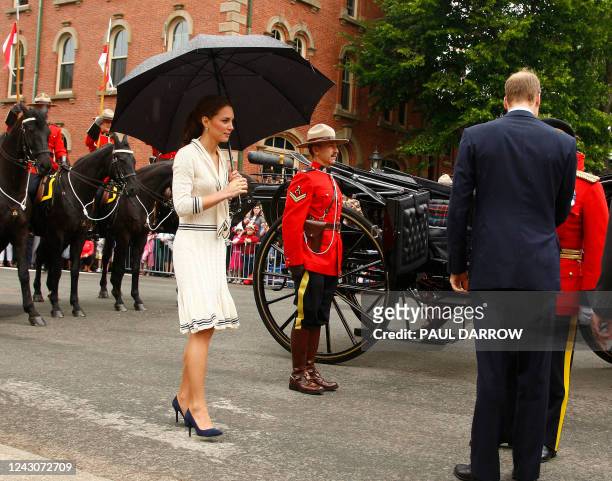 Britain's Prince William and Catherine, the Duchess of Cambridge prepare to board the State landau for a ride down Great George Street, in...