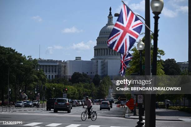 Workers place British flags along Pennsylvania Avenue in Washington, DC, on September 9 to honor Queen Elizabeth II. Queen Elizabeth II, the...