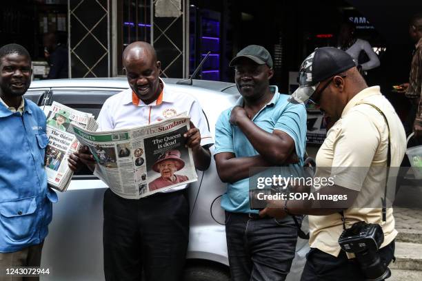 Man is seen reading newspapers with a front page image of Queen Elizabeth II. Queen Elizabeth II died on Thursday, September 8 at the age of 96.