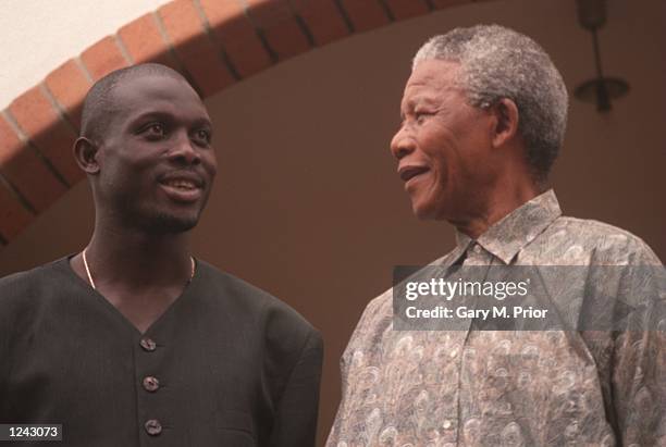 George Weah of Liberia meets South African President, Nelson Mandela at Mandela's house in Houghton, South Africa. Mandatory Credit: Gary...