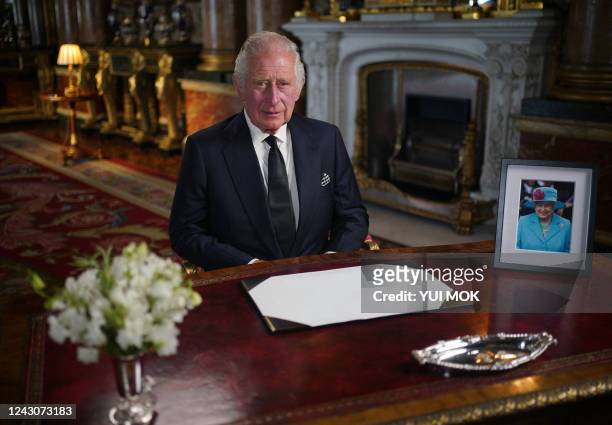 Britain's King Charles III makes a televised address to the Nation and the Commonwealth from the Blue Drawing Room at Buckingham Palace in London on...