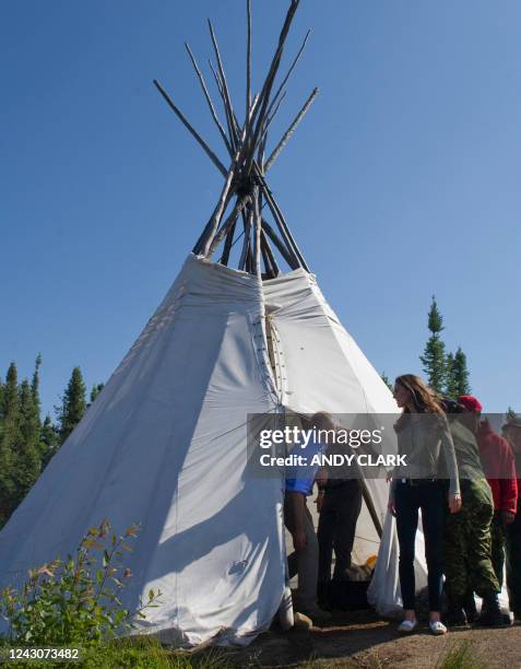 Britain's Prince William and his wife Catherine, Duchess of Cambridge eat a lunch of Arctic Char while Blatchford Lake, Northwest Territories July 5,...