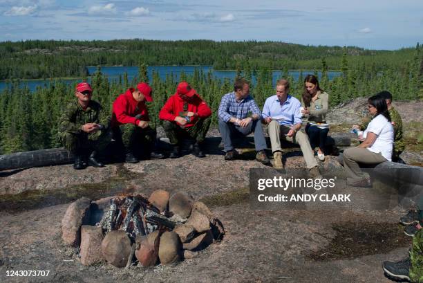 Britain's Prince William and his wife Catherine, Duchess of Cambridge eat a lunch of Arctic Char while Blatchford Lake, Northwest Territories July 5,...