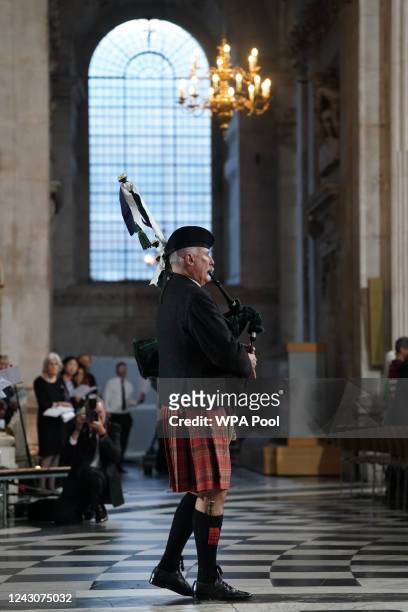 Piper plays during a service of prayer and reflection, following the passing of Britain's Queen Elizabeth, at St Paul's Cathedral on September 9,...