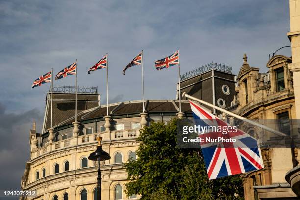The flag of Great Britain waving in the city of London, the capital of the United Kingdom. The flag, commonly known as King's Colours, the first...
