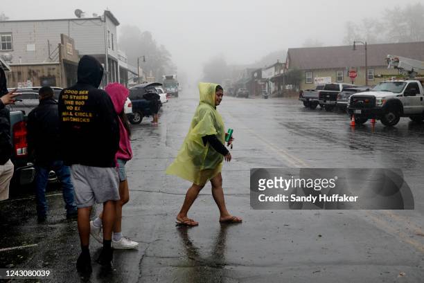 Visitors walk in Downtown Julian as winds and rain fall on September 9, 2022 inJulian, California. The Tropical Storm, which produced winds up to 109...