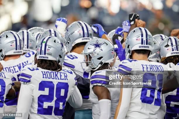 The Dallas Cowboys huddle during warm-ups before the game between the Dallas Cowboys and the Seattle Seahawks on August 26, 2022 at AT&T Stadium in...