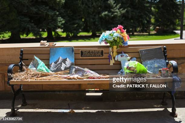 Flowers rest on the Matthew Shepard Memorial Bench, in memory of a gay student who in 1998 was beaten, tortured, and left to die near Laramie, on the...