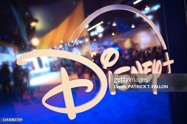 Fans are reflected in Disney+ logo during the Walt Disney D23 Expo in Anaheim, California on September 9, 2022.