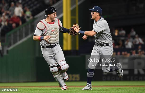 Andrew Knizner of the St. Louis Cardinals celebrates with Lars Nootbaar after turning a double play in the seventh inning during the game against the...