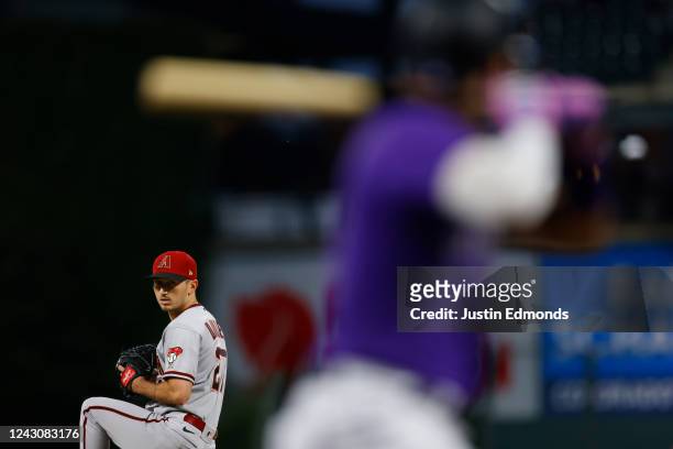 Starting pitcher Zach Davies of the Arizona Diamondbacks delivers to home plate in the first inning against the Colorado Rockies at Coors Field on...