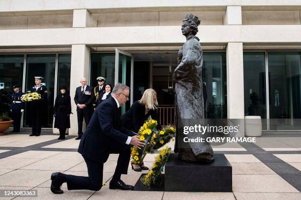 Australia's Prime Minister Anthony Albanese and Finance Minister Katy Gallagher lay a wreath at the statue of Britain's Queen Elizabeth II at...