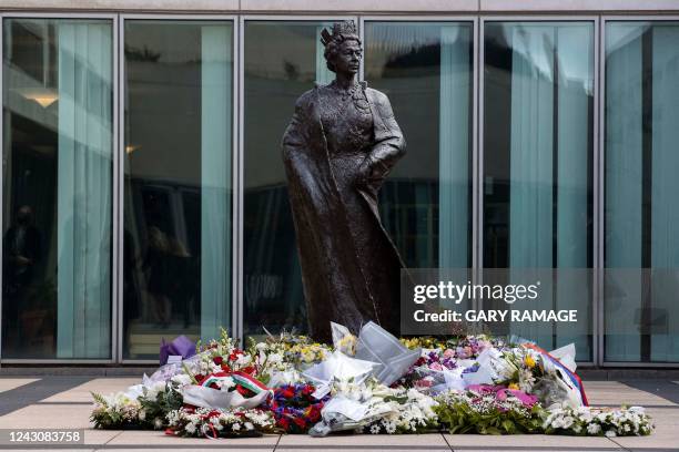 This picture shows the statue of Britain's Queen Elizabeth II after a wreath laying ceremony at Parliament House in Canberra on September 10, 2022....